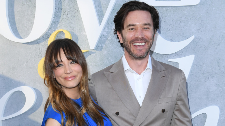 Kaley Cuoco and Tom Pelphrey smiling.