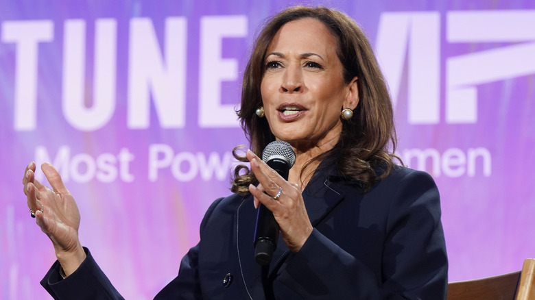 Kamala Harris speaking into microphone