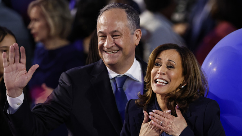 Kamala Harris and Doug Emhoff smiling onstage