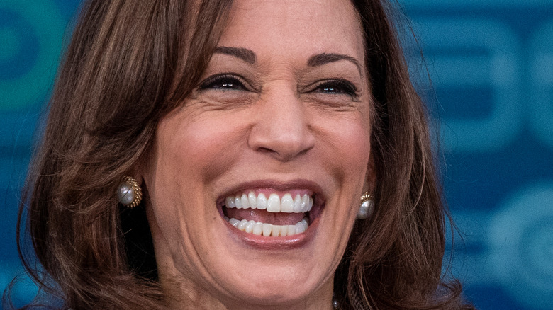 Vice President Kamala Harris laughing on the podium