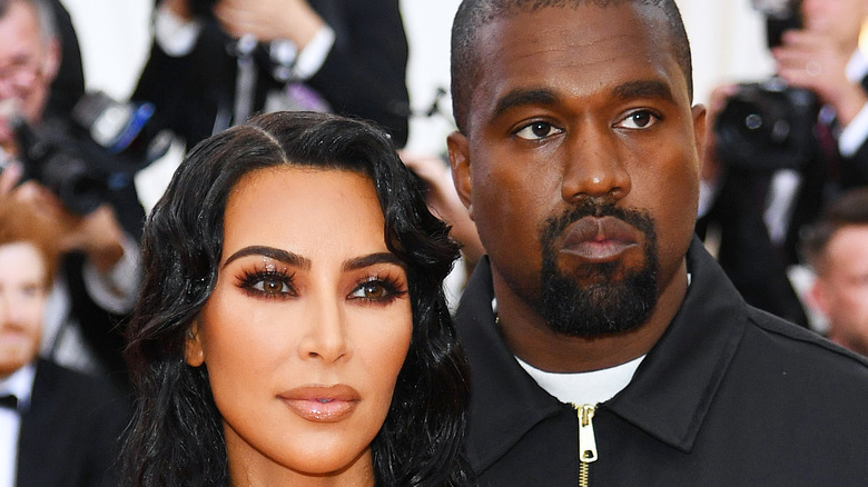 Kim Kardashian and Kanye West looking serious on the red carpet
