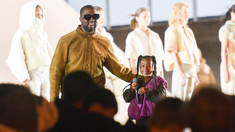 Kanye West and North West during the 2020 "Yeezy Season 8" show