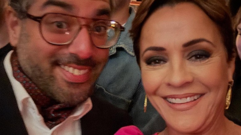 Raheem Kassam and Kari Lake pose together for a selfie at Butterworth's in 2025