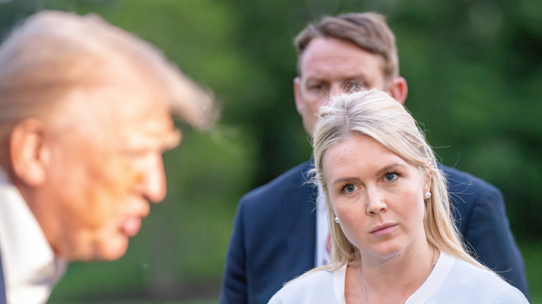 Karoline Leavitt looking at Donald Trump