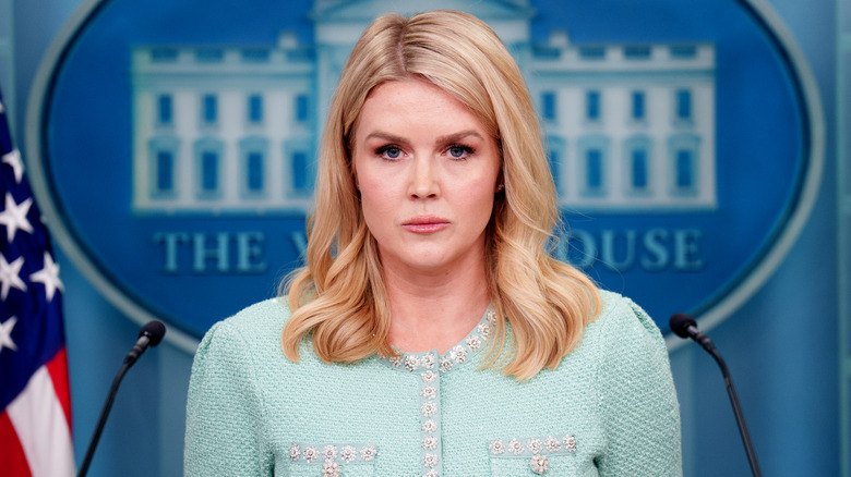Karoline Leavitt giving a press conference at the White House