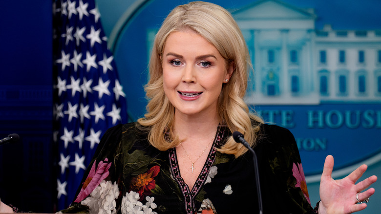 Karoline Leavitt lifting hands while speaking