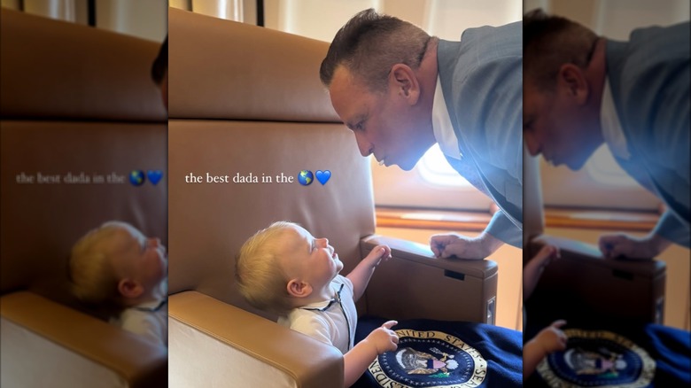 Nicholas Riccio looking at son Niko