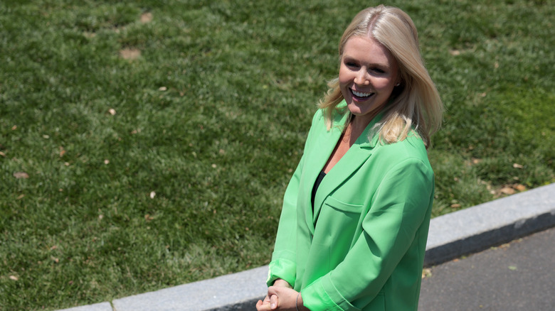 Karoline Leavitt wears a green blazer