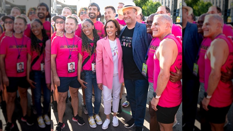 Kamala Harris and Doug Emhoff posing with fans