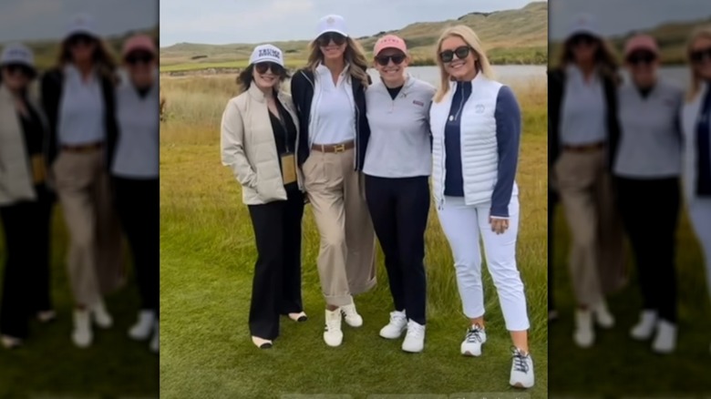 Chamberlain Harris, Lara Trump, Kimberly Benza, and Karoline Leavitt posing for a photo in Scotland