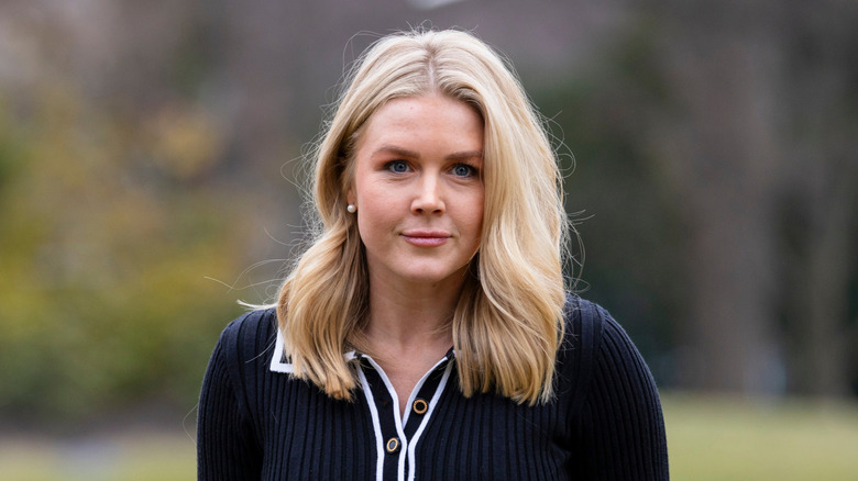 Karoline Leavitt walking across the White House South Lawn