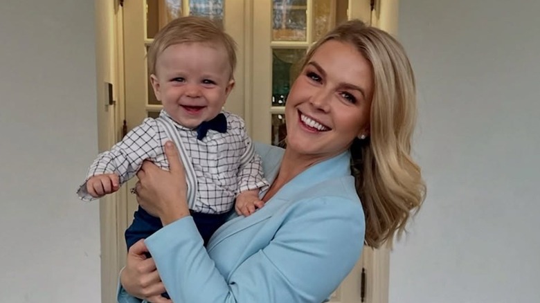 Karoline Leavitt smiling and holding her son Niko