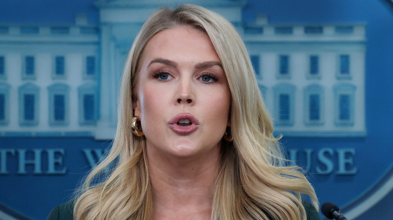 Karoline Leavitt speaking during a press briefing while wearing a blazer.