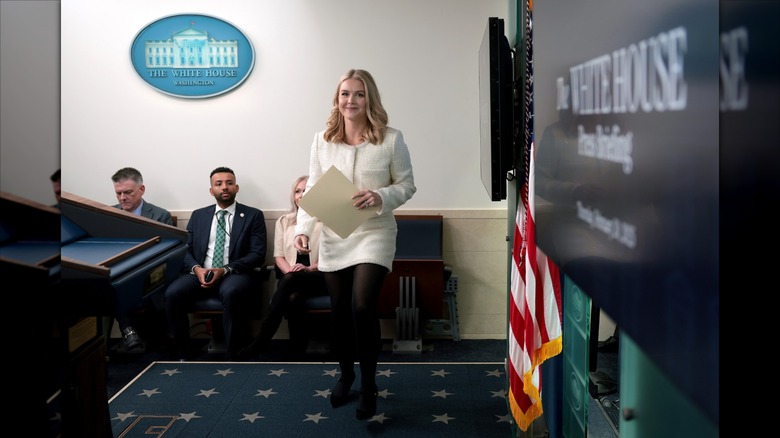 Karoline Leavitt stepping up to her press room podium.