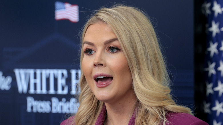 Karoline Leavitt pointing at microphone