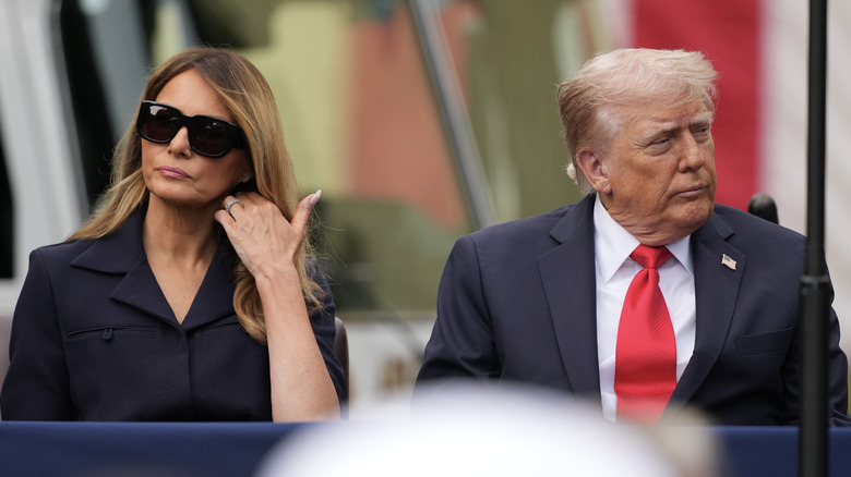 Melania and Donald Trump frowning