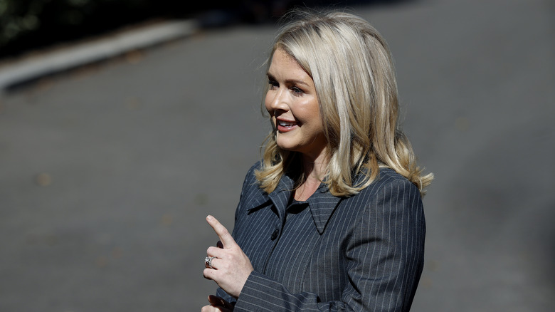 Karoline Leavitt pointing while speaking to reporters