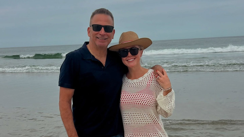 Nicholas Riccio and Karoline Leavitt posing for a photo at the beach