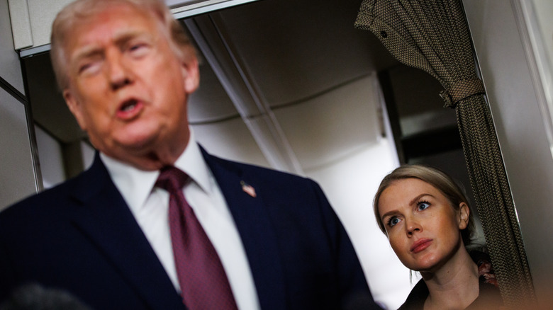 Karoline Leavitt staring at Donald Trump