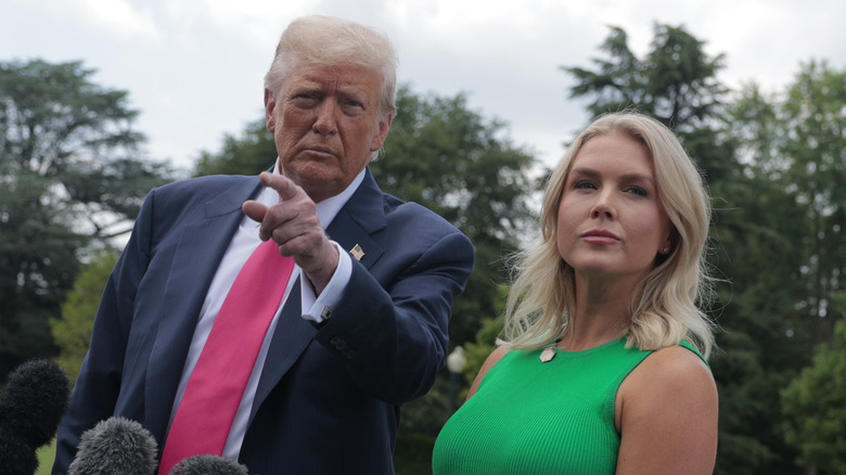 Donald Trump pointing next to Karoline Leavitt
