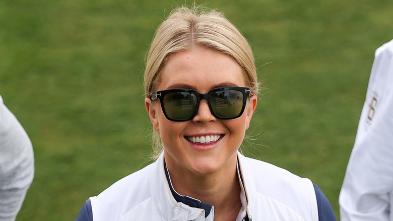 Karoline Leavitt smiling in sunglasses