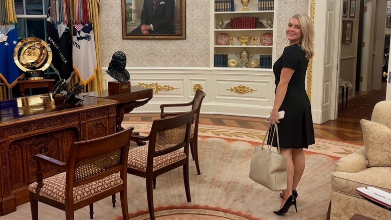 karoline leavitt posing in the Oval Office