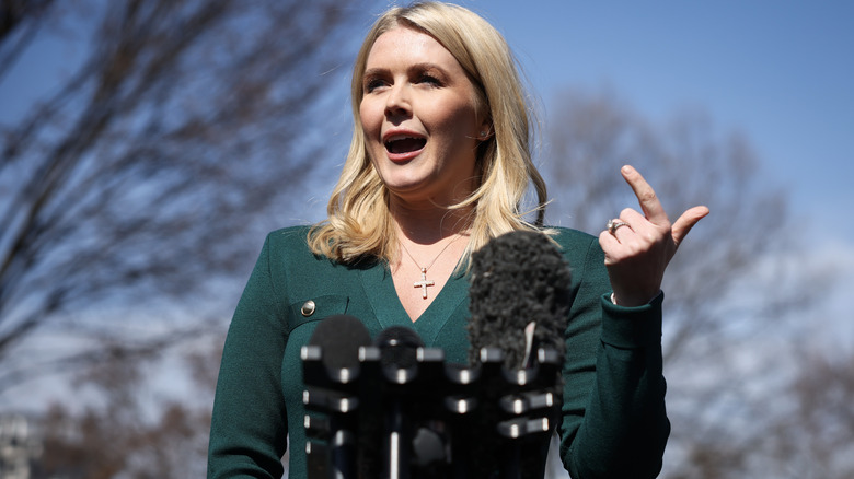 Karoline Leavitt addressing reporters in a green top