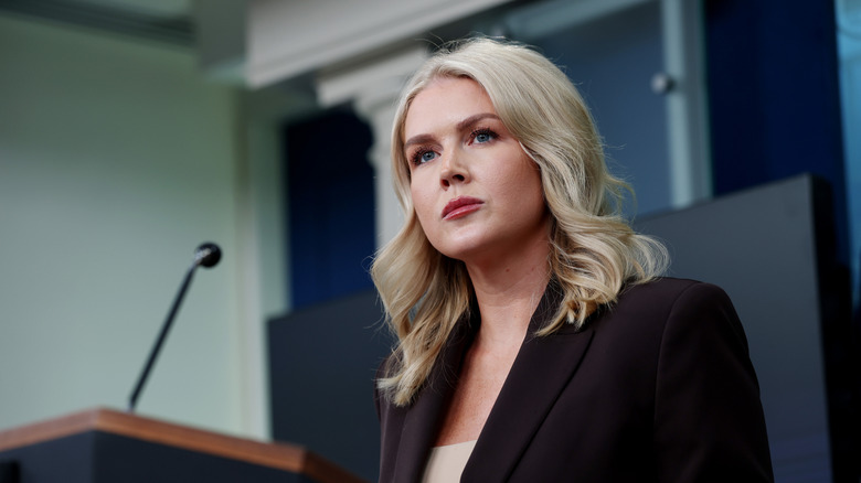 Karoline Leavitt giving a press conference at the White House