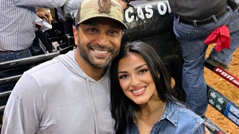 Kash Patel and Alex Wilkins hug at a bull riding competition in Nashville, TN (2025)