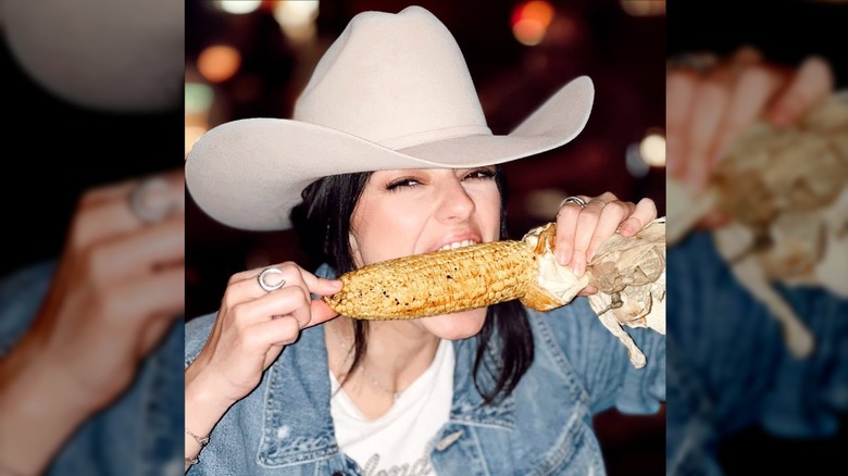 Alexis Wilkins eats corn.