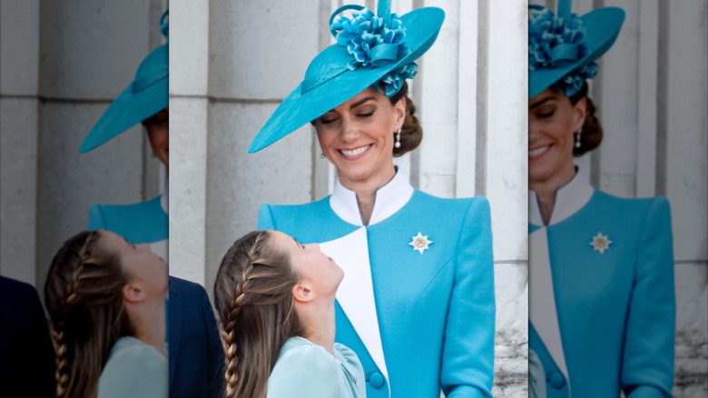 Kate Middleton smiling down at Princess Charlotte