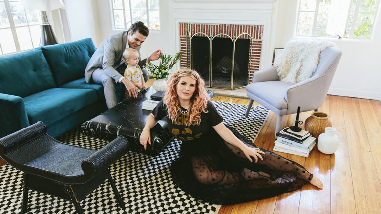 Kate and Joey posing with their son  