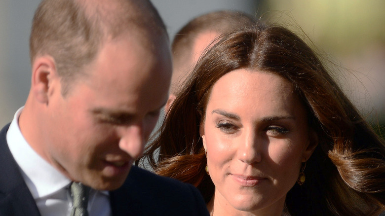 Kate Middleton glancing at Prince William while walking 