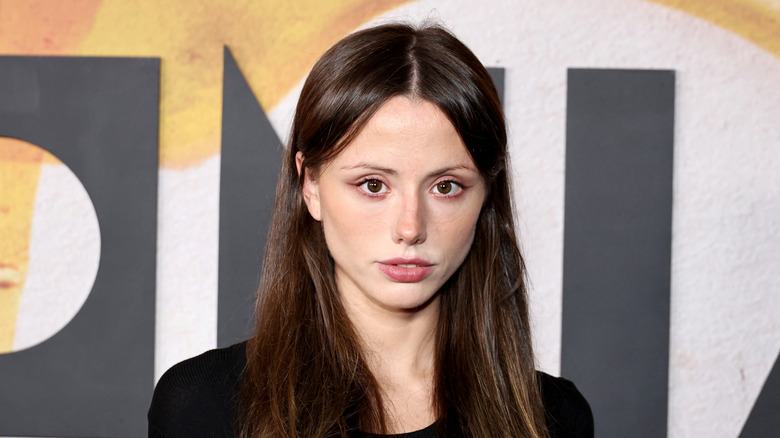 Lily Mo Sheen posing at the Bugonia premiere