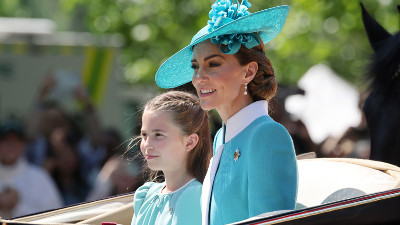 Princess Catherine and Princess Charlotte riding together in a carriage at Trooping the Colour 2025