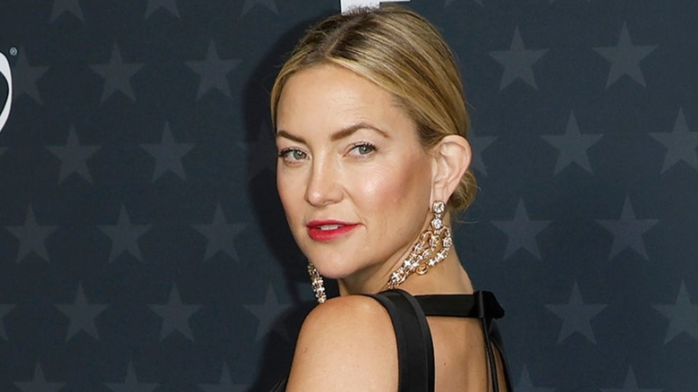 Kate Hudson wearing a black dress