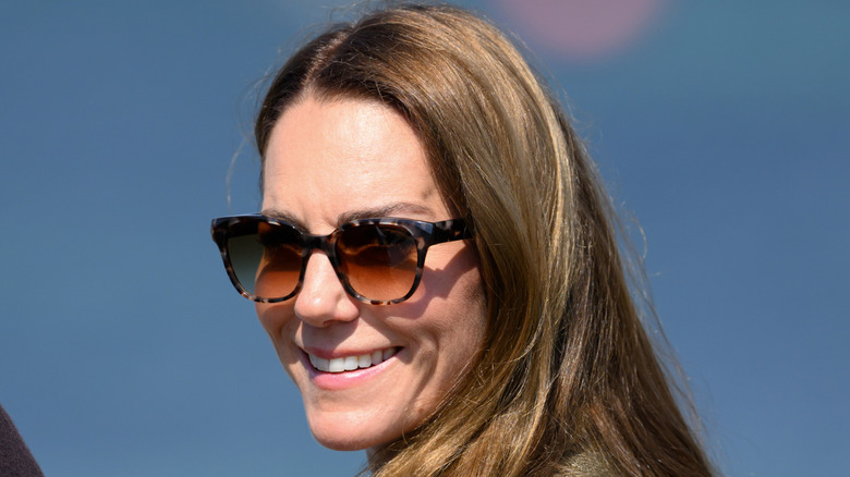 Kate Middleton smiling in sunglasses