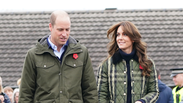 Prince William and Princess Kate walking outside