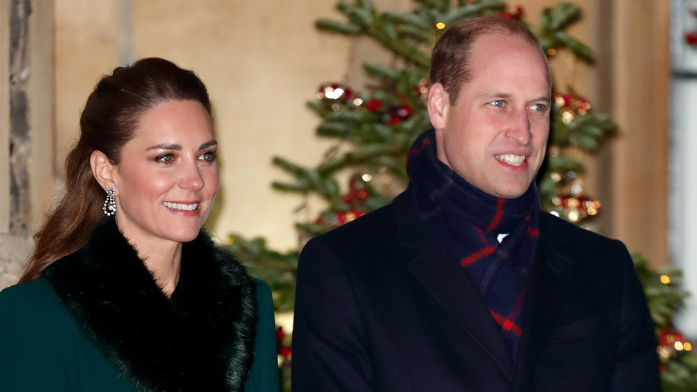 Kate Middleton and Prince William in front of Christmas tree