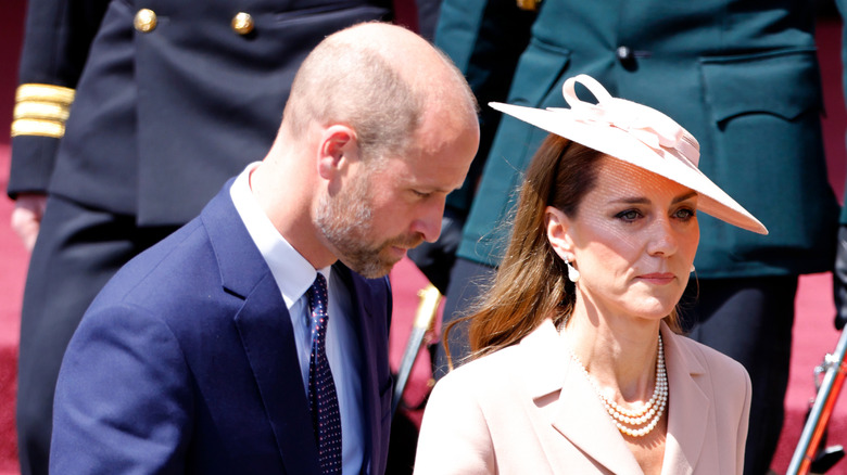 Prince William and Princess Catherine looking serious