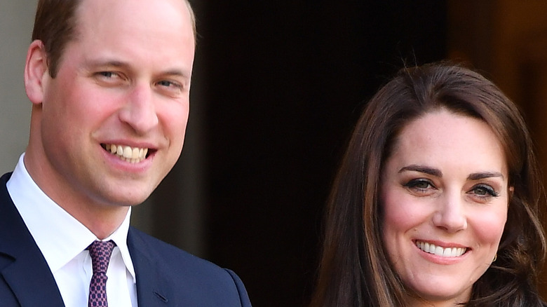 Prince William and Kate Middleton smile during a royal engagement
