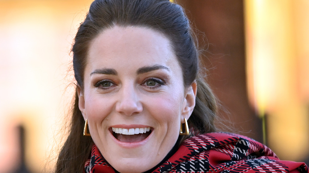 Kate Middleton smiling, scarf