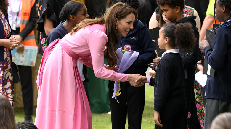 Kate Middleton shaking hands 
