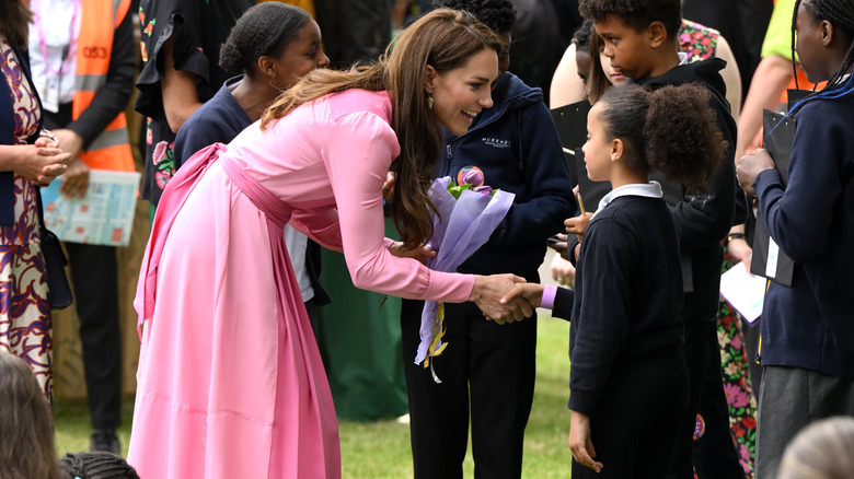 Kate Middleton shaking hands 