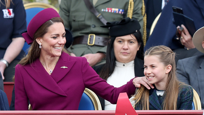 Kate Middleton smiling with Princess Charlotte