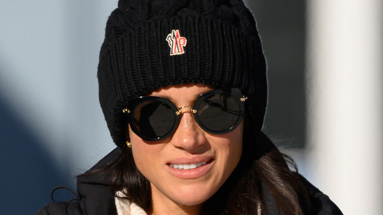 Meghan Markle wearing sunglasses and a beanie