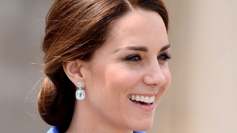 Kate Middleton smiles for photographers