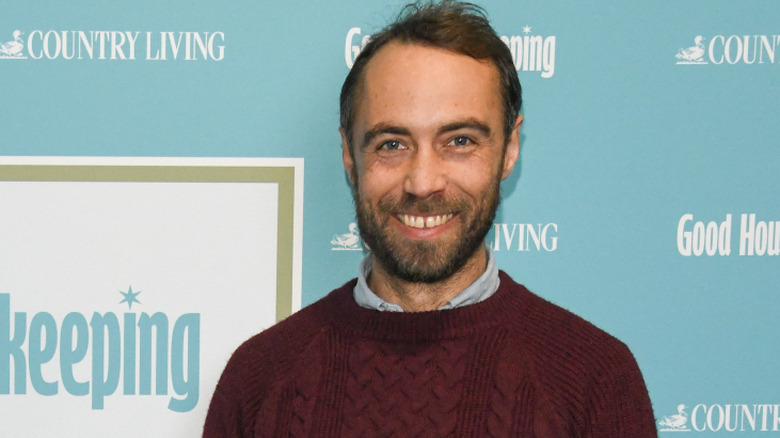 James Middleton smiling at the camera
