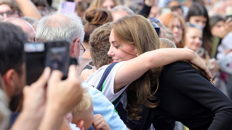 Kate Middleton hugging a fan