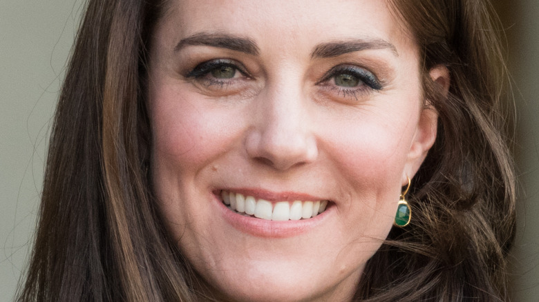 Kate Middleton smiling in green in 2017